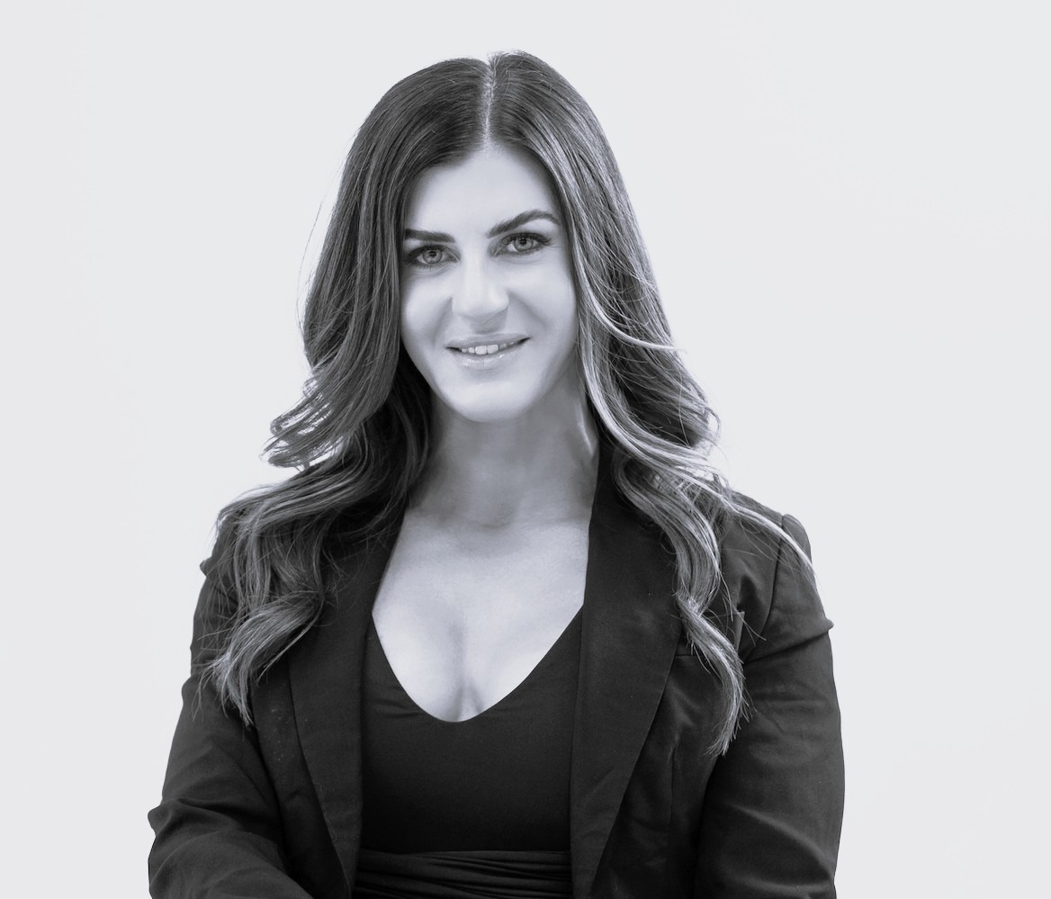 Kelly Hunter, Director of Regulatory Affairs at Orthocell, professional headshot portrait in black and white